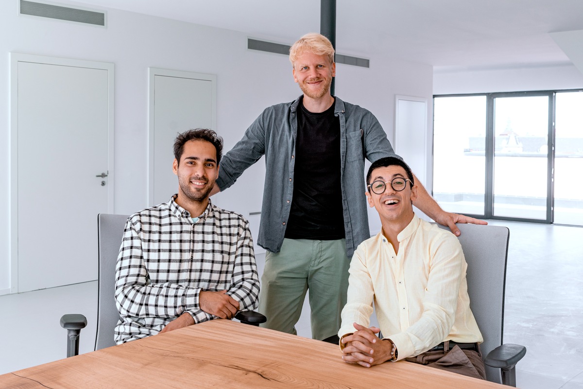 Piran Asci seated in a checked shirt in a 2022 KoRo management photograph