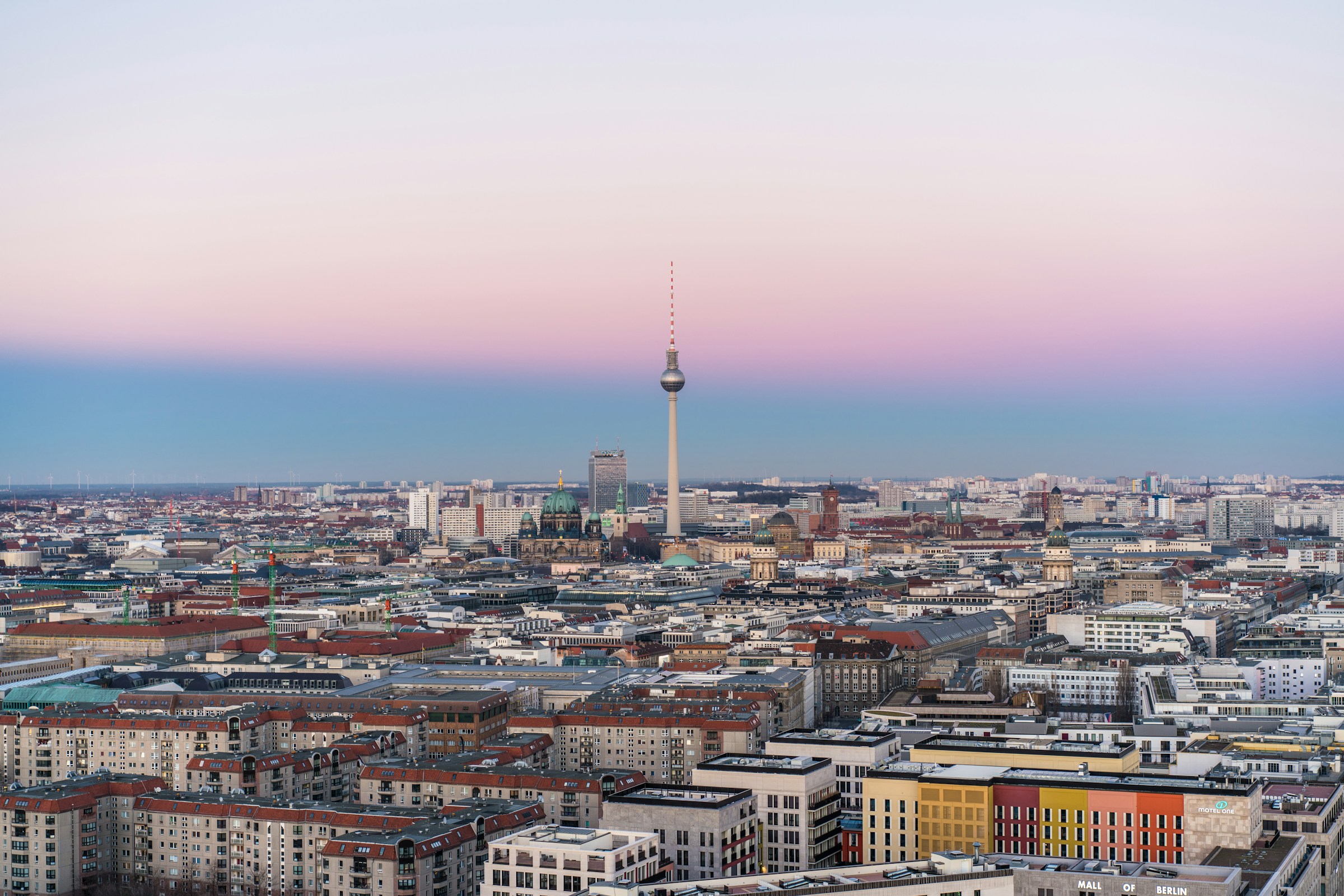 Berlin cityscape with the complete Fernsehturm and Berliner Dom at dusk